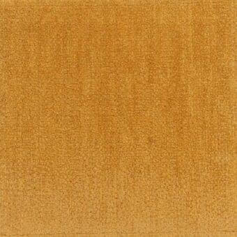 Mustard yellow fabric texture, short-pile plush textile with granular surface, consistent depth and even lighting throughout the frame.